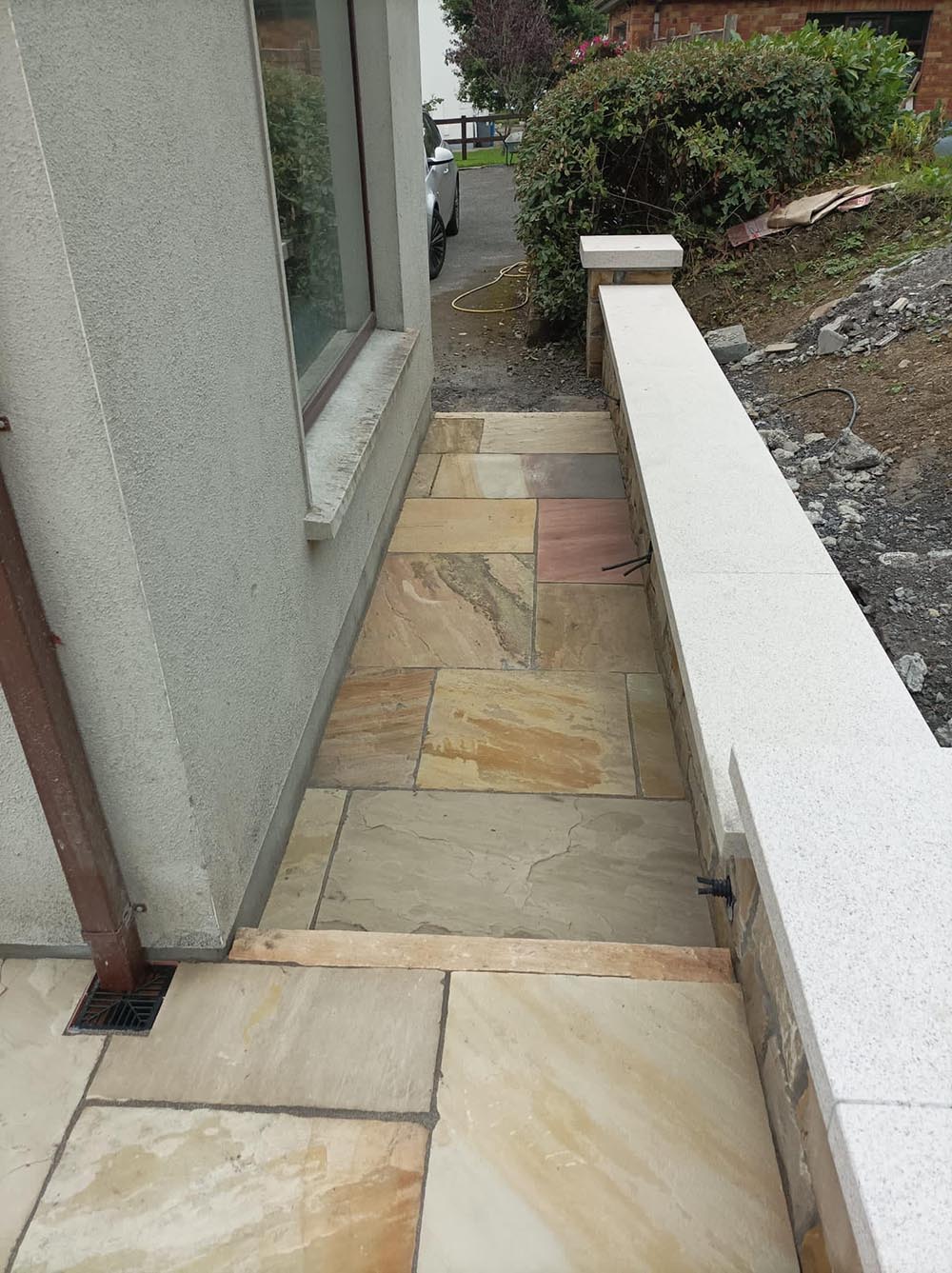 Patio steps leading to the side of the house